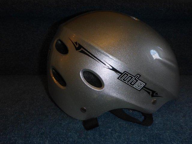 Preview of the first image of Mountain boarding MBS insignia silver helmet size 54-58cm.