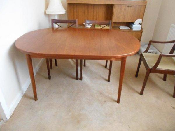 Image 1 of G-PLAN ROUND-ENDED TEAK EXTENDING DINING TABLE