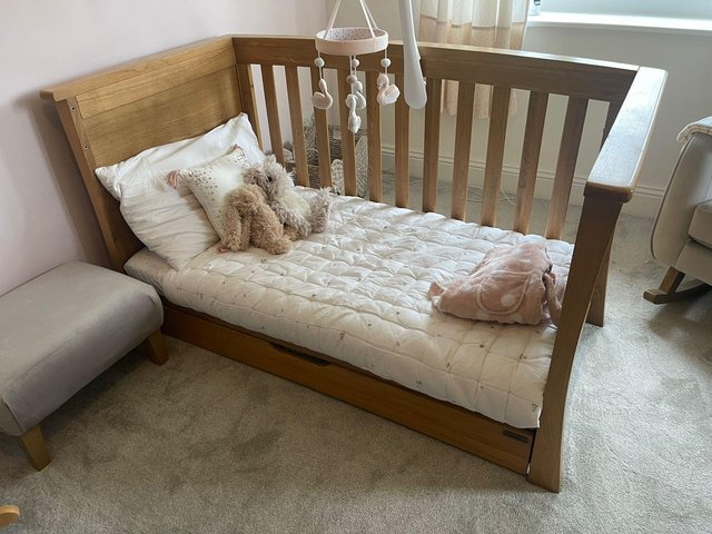Preview of the first image of Mamas and Papas solid oak cot/ bed.