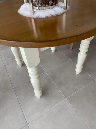Image 1 of Wood and cream base legged table