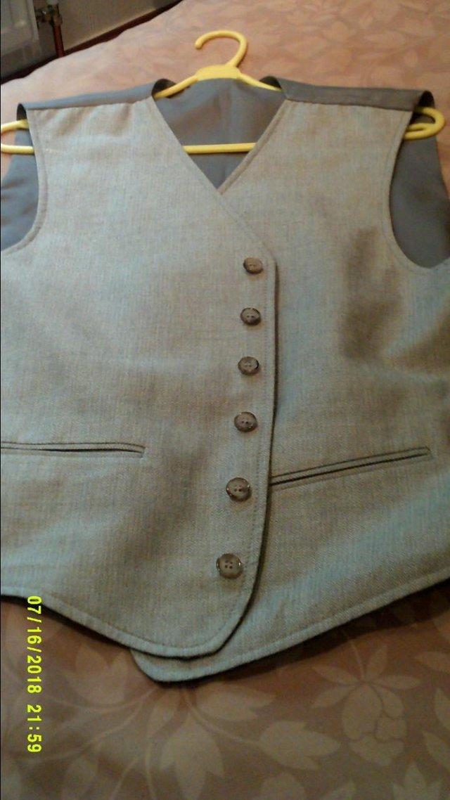 Preview of the first image of Reversible Waist coat. Size 40-42 inch..
