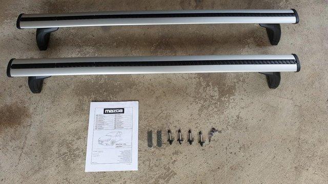 Preview of the first image of Genuine Mazda roof rails to fit the Mazda 3 Mk 3.